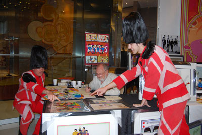 LOVE SHOW GUARDSMEN TAKE A TIME OUT TO ADMIRE RON CAMPBELL'S ART