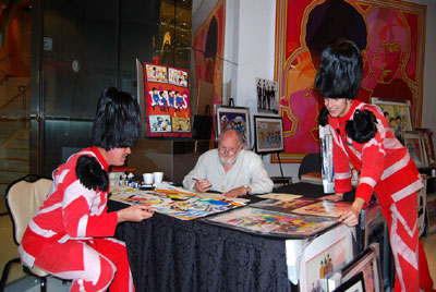 LOVE SHOW GUARDSMEN TAKE A TIME OUT TO ADMIRE RON CAMPBELL'S ART